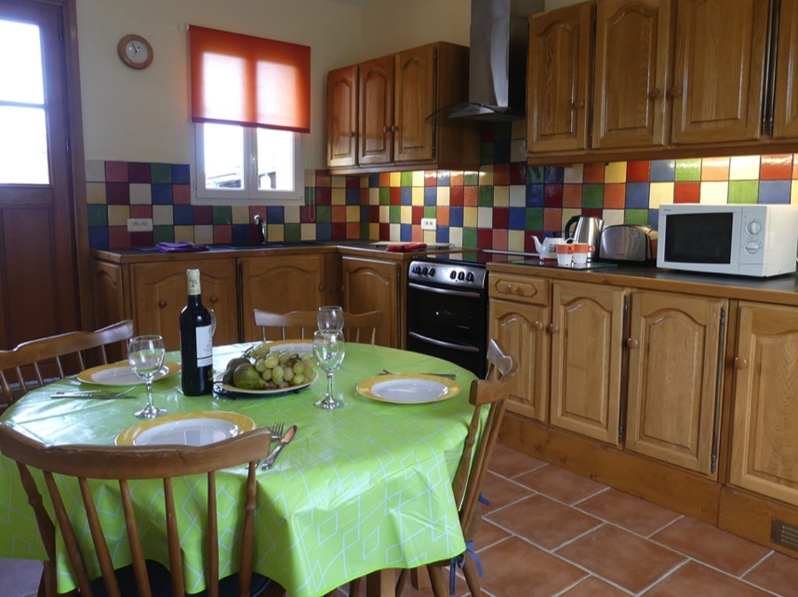 The fully equipped kitchen at La Maison du Soleil Holiday Cottage